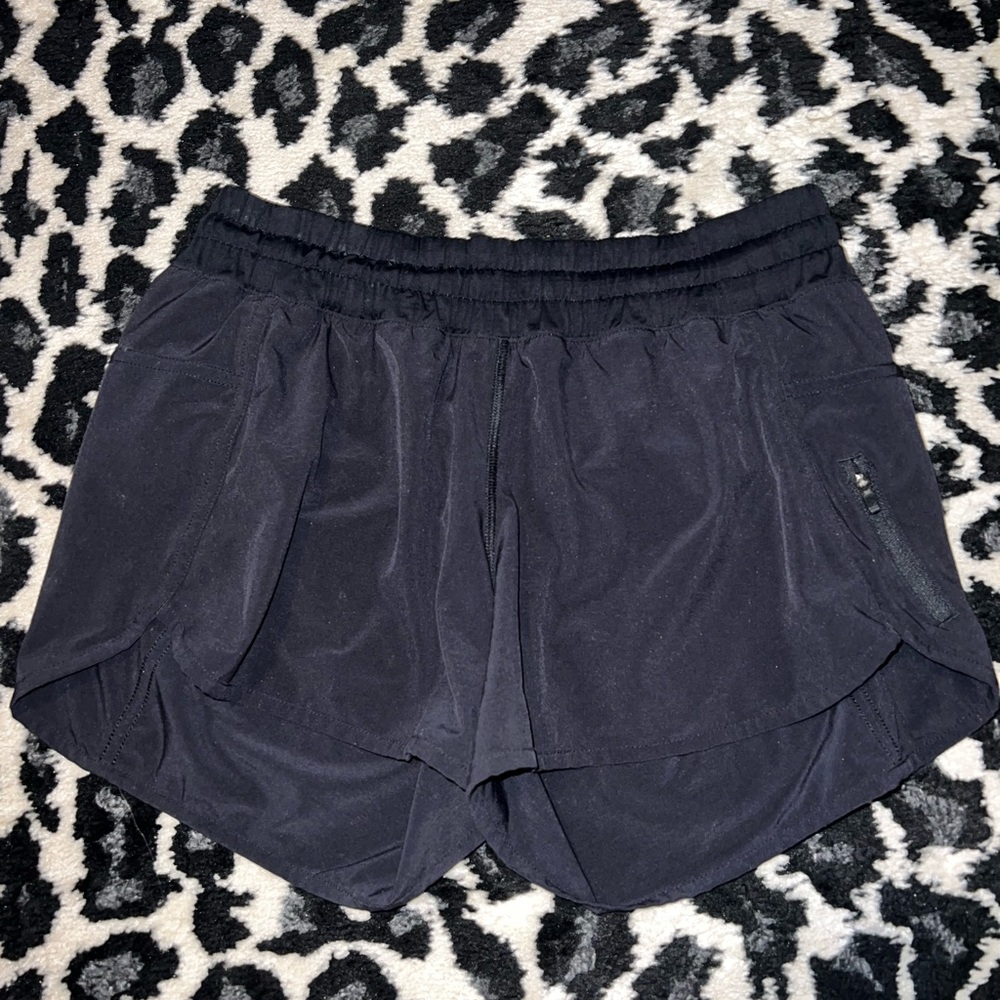 Lululemon track that low rise lined black shorts. Size 10.
